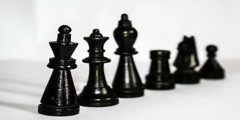 black chess pieces demonstrating business hierarchy