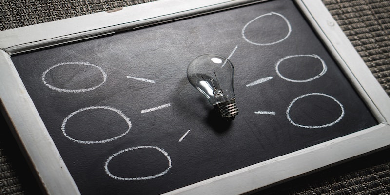 lightbulb on chalkboard signifying understanding